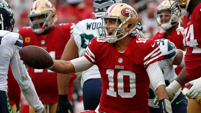 Jimmy Garoppolo smiles after a play during the 49ers’ victory over the Seahawks.